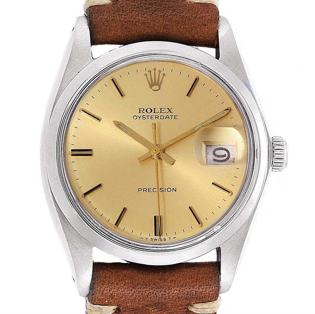 This image shows a front view of a Rolex Vintage Collection 6694 Men's Stainless Steel Champagne Dial 6694 Men's Stainless Steel Champagne Dial Oysterdate Precision watch with a gold dial and brown leather strap.