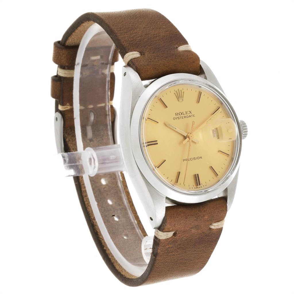 The image shows a Rolex Vintage Collection 6694 Men's Stainless Steel Champagne Dial 6694 Men's Stainless Steel Champagne Dial watch at a side angle, highlighting its face, bezel, crown, and leather strap.