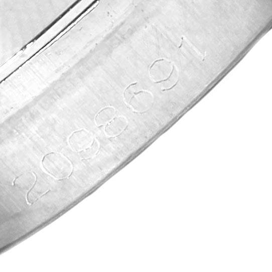 This image shows the serial number engraving on the case of a Vintage Collection model by Rolex, viewed closely.