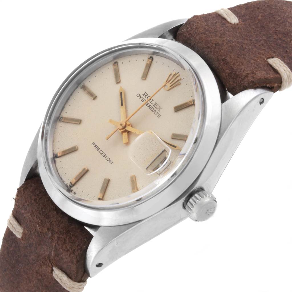 This image shows a close-up, side-angle view of a Rolex Vintage Collection 6694 Men's Stainless Steel Silver Dial 6694 Men's Stainless Steel Silver Dial model watch, highlighting the dial, crown, and leather strap.