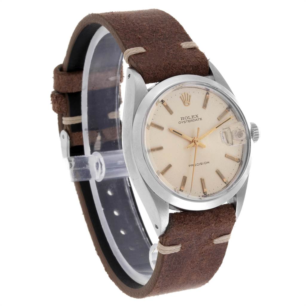 The image shows a side view of the Rolex Vintage Collection 6694 Men's Stainless Steel Silver Dial 6694 Men's Stainless Steel Silver Dial model with a beige dial, stainless steel case, and a brown leather strap.