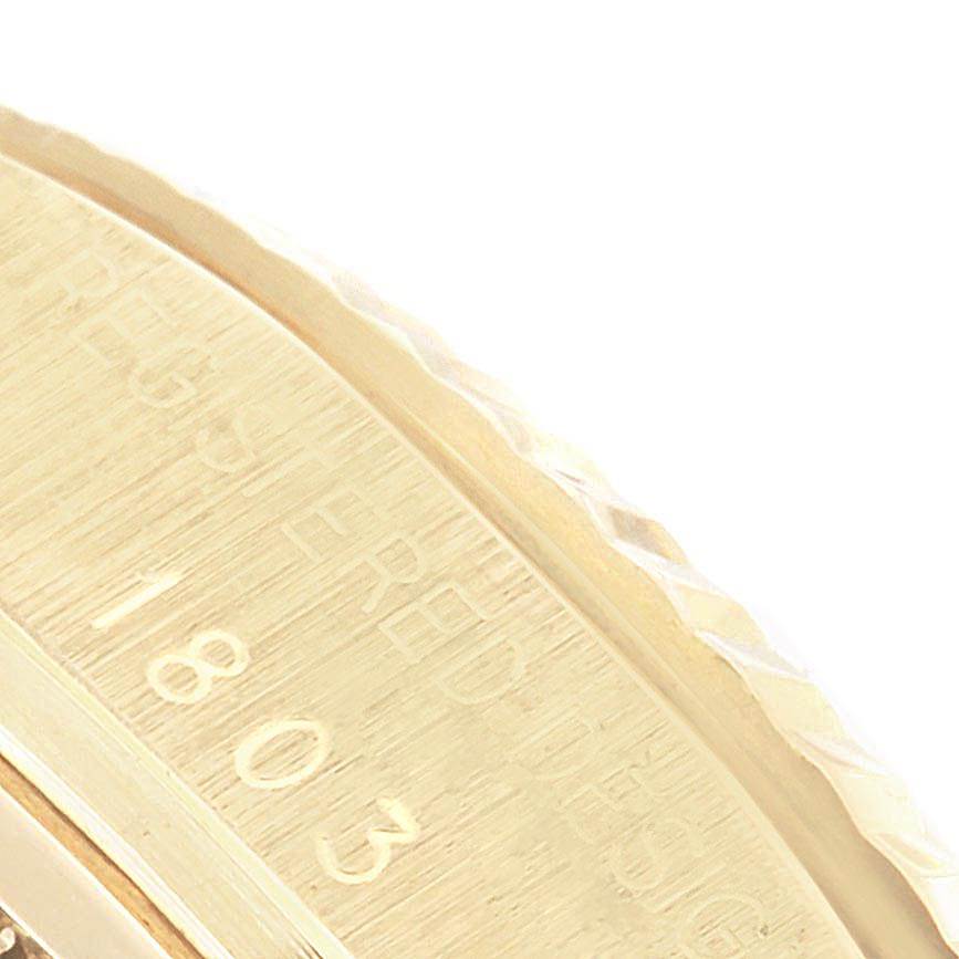 This image shows a close-up angle of the engraved edge and bezel of a Rolex Vintage Collection 1803 Men
s Yellow Gold Champagne Dial 1803 Men
s Yellow Gold Champagne Dial watch.