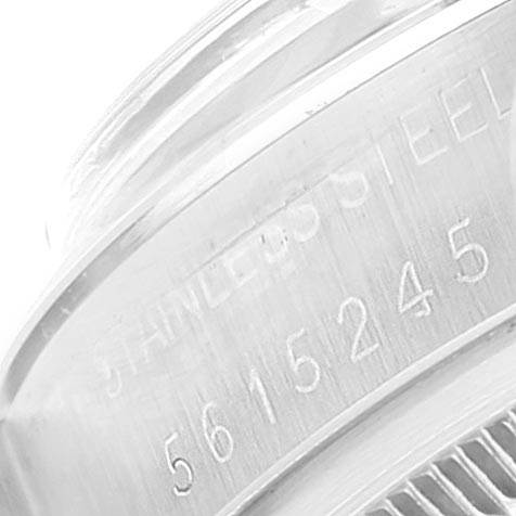 This close-up image of the Vintage Collection model by Rolex shows the engraved serial number and part of the stainless steel casing.