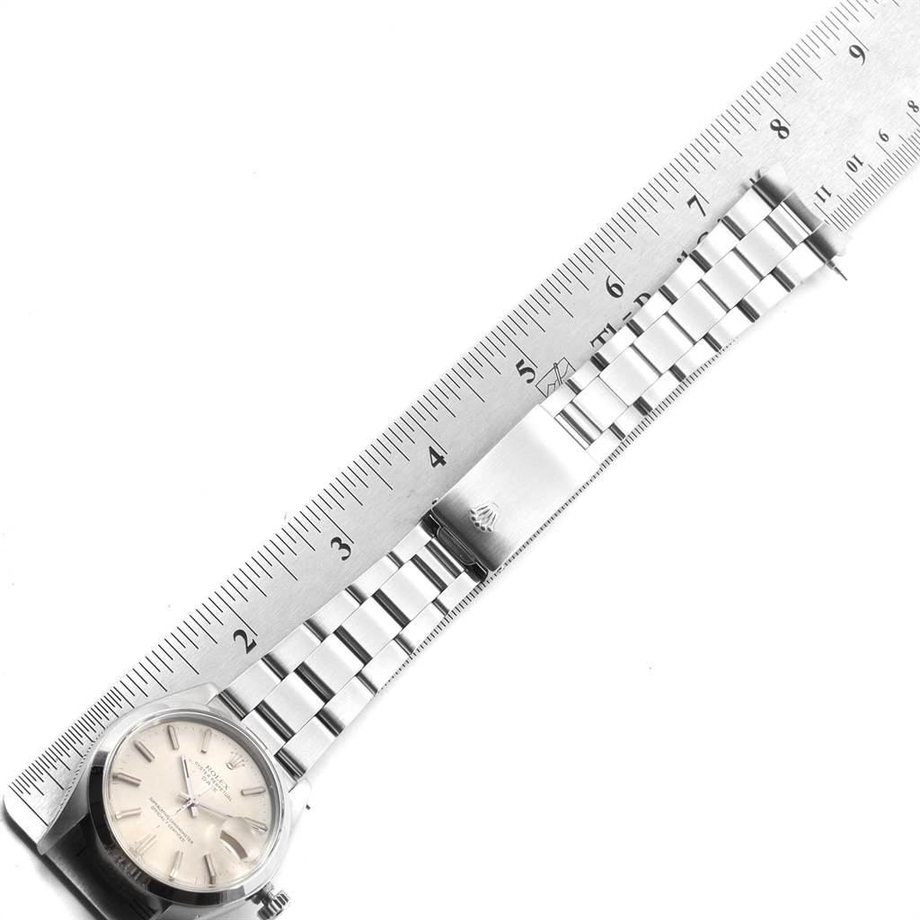 The image shows a Vintage Collection Rolex watch lying flat with its bracelet extended alongside a ruler for measurement.