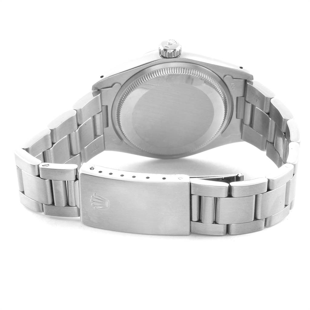 The image shows the back casing and metal strap of a Rolex Vintage Collection 1500 Men's Stainless Steel Silver Dial 1500 Men's Stainless Steel Silver Dial watch.