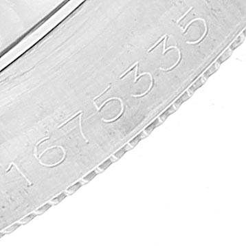 The image shows a close-up of the serial number engraved on the case of a Vintage Collection model by Rolex.