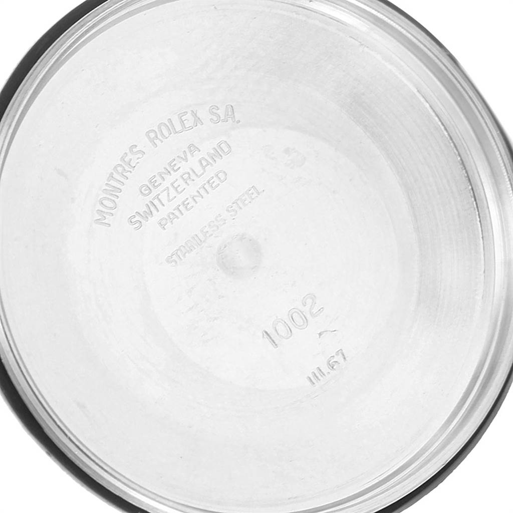 The image shows the inside case back of a Vintage Collection model by Rolex, displaying engraving details.