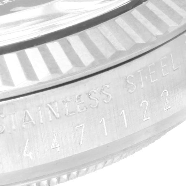 The image shows a close-up side view of the bezel and part of the case with engravings on the Rolex Vintage Collection 1601 Men's Stainless Steel Black Dial 1601 Men's Stainless Steel Black Dial watch.
