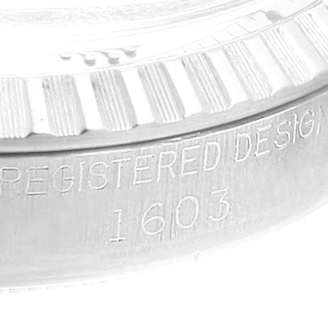This close-up image shows the side view of the bezel and engraved serial number "1603" of a Rolex Vintage Collection 1603 Men's Stainless Steel Silver Dial 1603 Men's Stainless Steel Silver Dial watch.