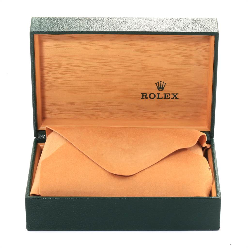 This image shows an open Rolex Vintage Collection 16013 Men's Stainless Steel Champagne Dial 16013 Men's Stainless Steel Champagne Dial watch box with the watch inside an orange suede pouch.
