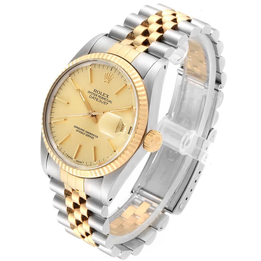 This is a Rolex Vintage Collection 16013 Men's Stainless Steel Champagne Dial 16013 Men's Stainless Steel Champagne Dial Oyster Perpetual Datejust watch, shown at an angled top view highlighting the gold and silver bracelet, bezel, and dial.