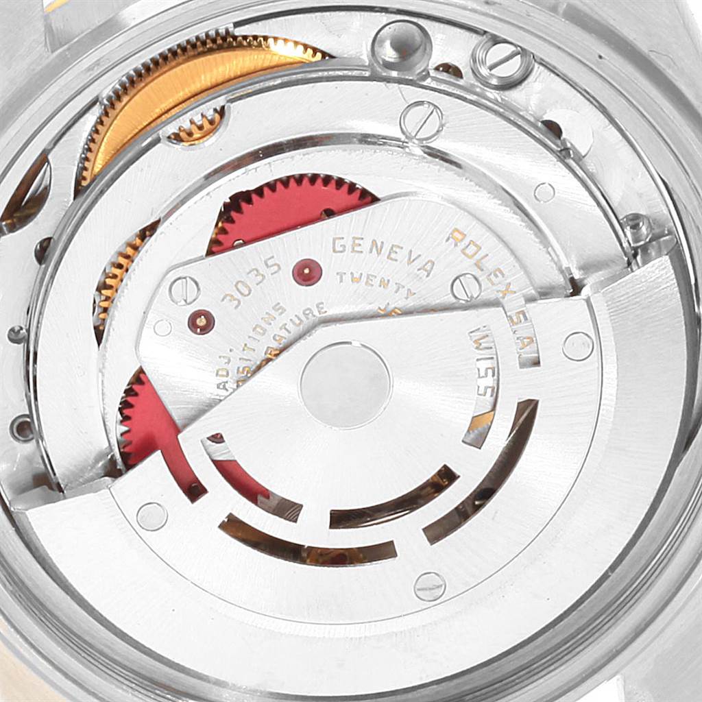 This close-up image shows the intricate internal mechanism of a Vintage Collection Rolex watch.