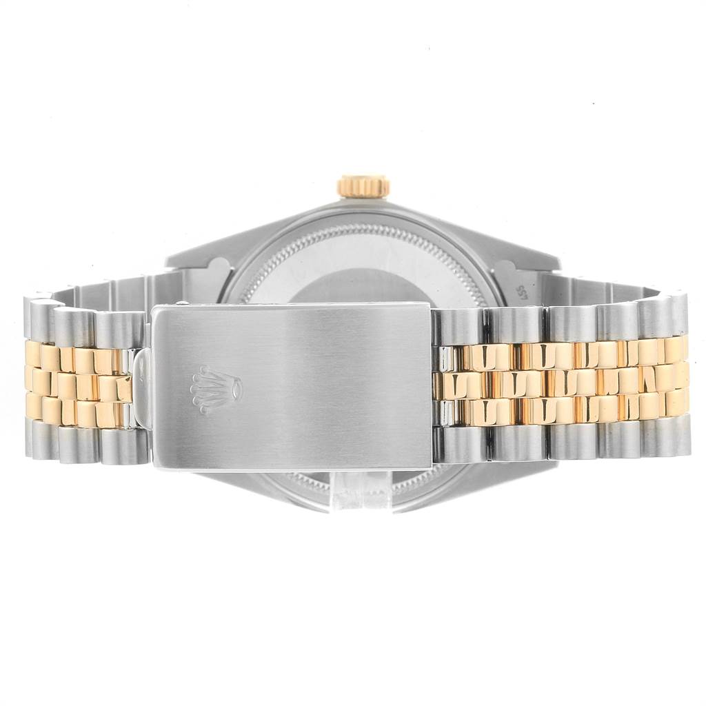 The image shows the back of a Rolex Vintage Collection 16013 Men's Stainless Steel Champagne Dial 16013 Men's Stainless Steel Champagne Dial watch, highlighting its clasp and two-tone metal bracelet.