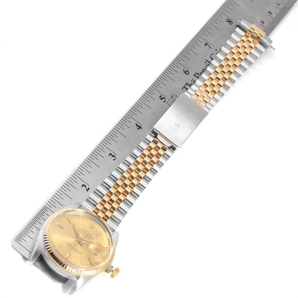 The Rolex Vintage Collection 16013 Men's Stainless Steel Champagne Dial 16013 Men's Stainless Steel Champagne Dial model watch is shown at an angle with a ruler measuring its face and bracelet.