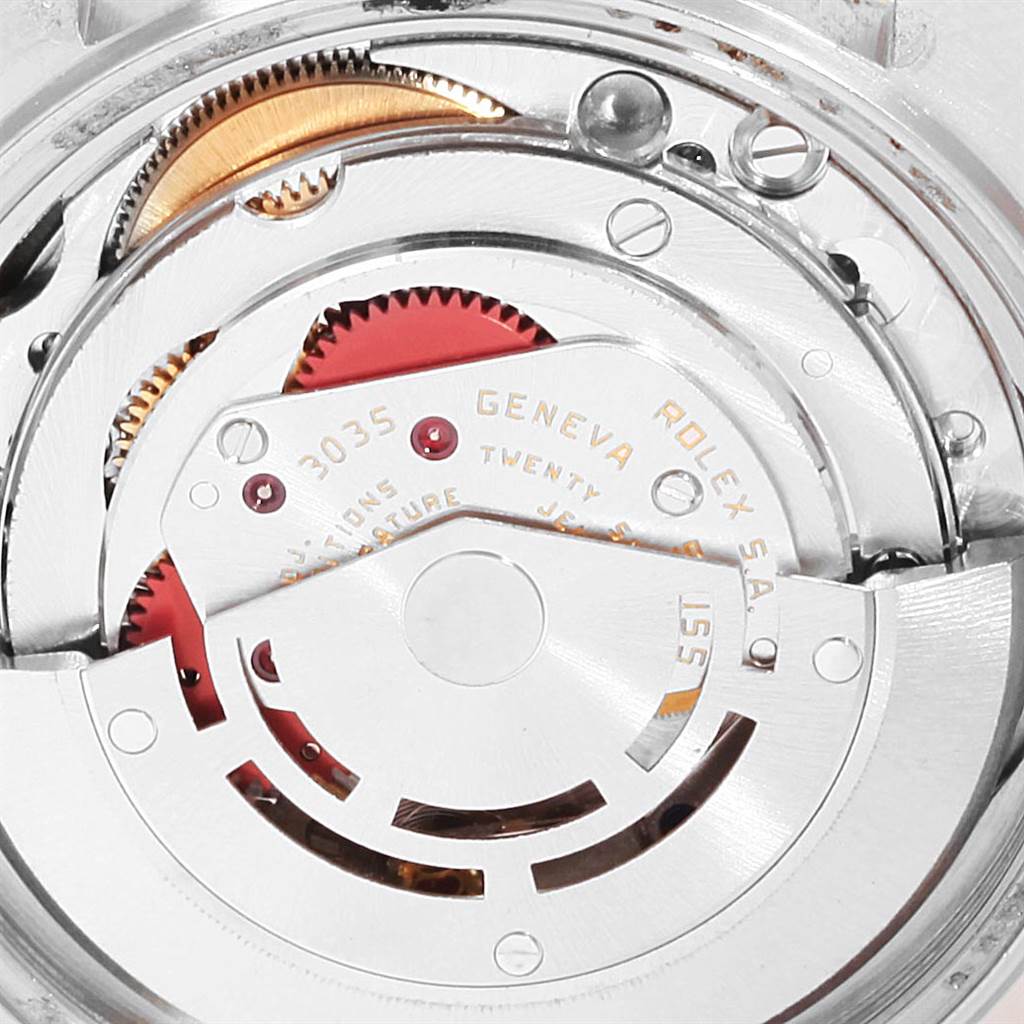 This close-up image shows the internal mechanics of a Rolex Vintage Collection 16013 Men's Stainless Steel Champagne Dial 16013 Men's Stainless Steel Champagne Dial model watch, highlighting gears and movement parts.