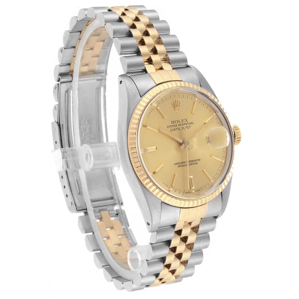 The image shows a side view of the Rolex Vintage Collection 16013 Men's Stainless Steel Champagne Dial 16013 Men's Stainless Steel Champagne Dial model's gold and silver bracelet and gold face.