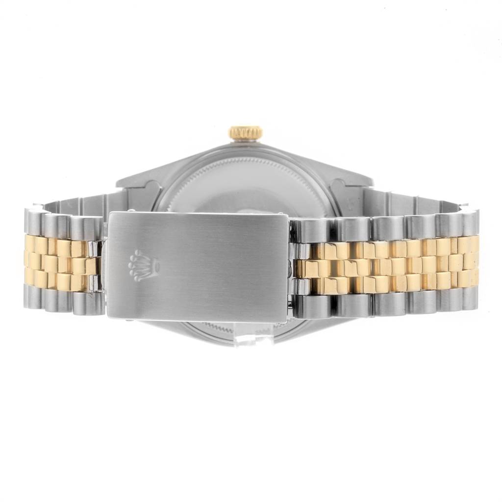 The image shows the back view of a Rolex Vintage Collection 16013 Men's Stainless Steel Champagne Dial 16013 Men's Stainless Steel Champagne Dial watch, focusing on its clasp and two-tone metal bracelet.