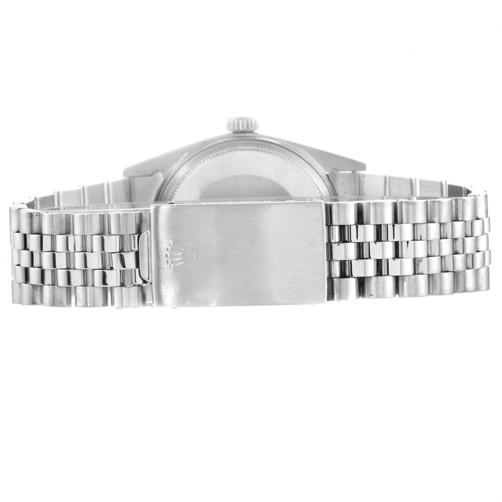 The image shows the back view of a Rolex Vintage Collection 1601 Men's Stainless Steel Black Dial 1601 Men's Stainless Steel Black Dial watch, focusing on its clasp and metal bracelet.