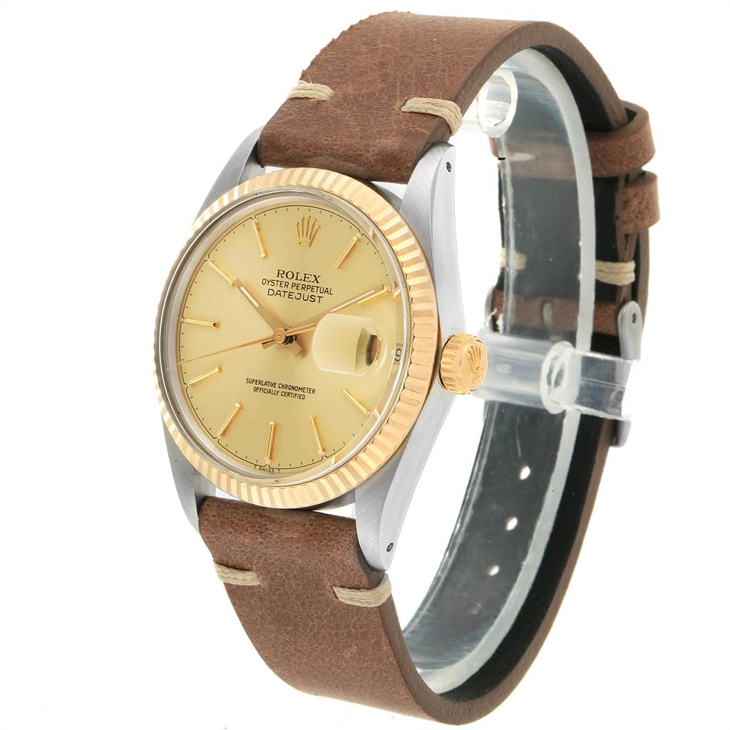 This image shows a Rolex Vintage Collection 16013 Men's Stainless Steel Champagne Dial 16013 Men's Stainless Steel Champagne Dial Datejust watch at a slight angle, highlighting the dial, bezel, crown, and leather strap.