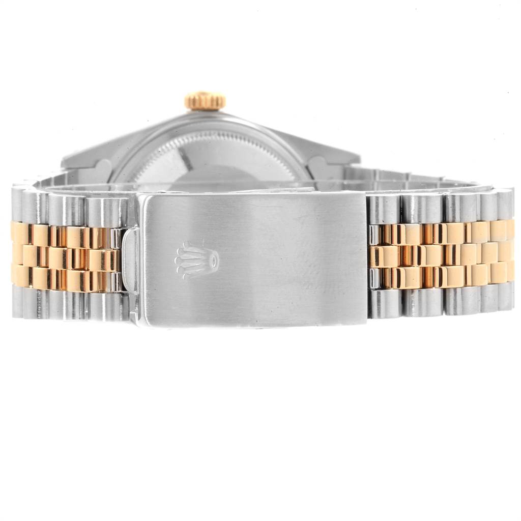 The image shows the back of a Rolex Vintage Collection 16013 Men's Stainless Steel Champagne Dial 16013 Men's Stainless Steel Champagne Dial model, featuring the clasp and part of the two-tone metal bracelet.