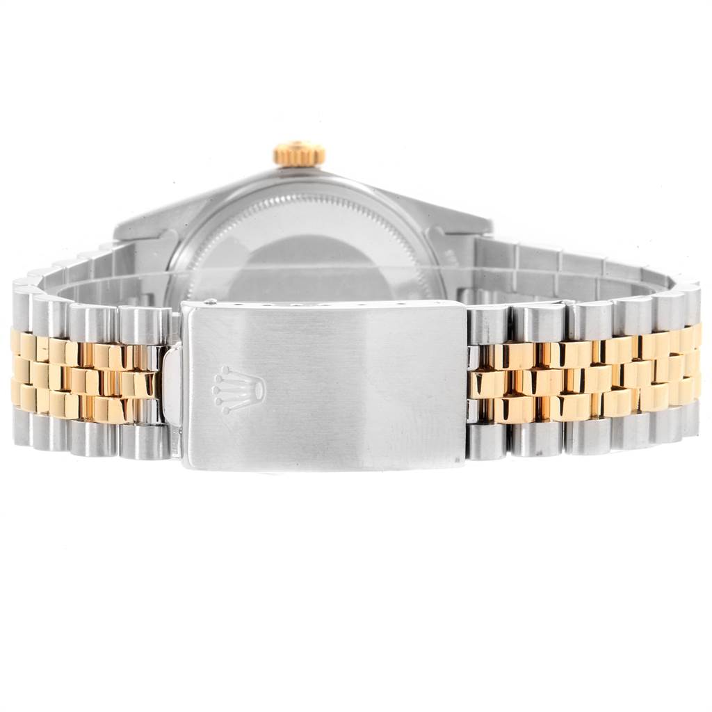 The image shows the back view of a Rolex Vintage Collection 16013 Men's Stainless Steel White Dial 16013 Men's Stainless Steel White Dial watch, highlighting its clasp and bicolored bracelet.