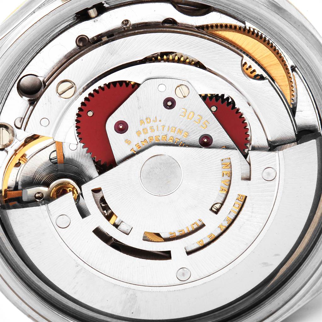 The image shows the intricate internal movement components of a Vintage Collection Rolex watch.