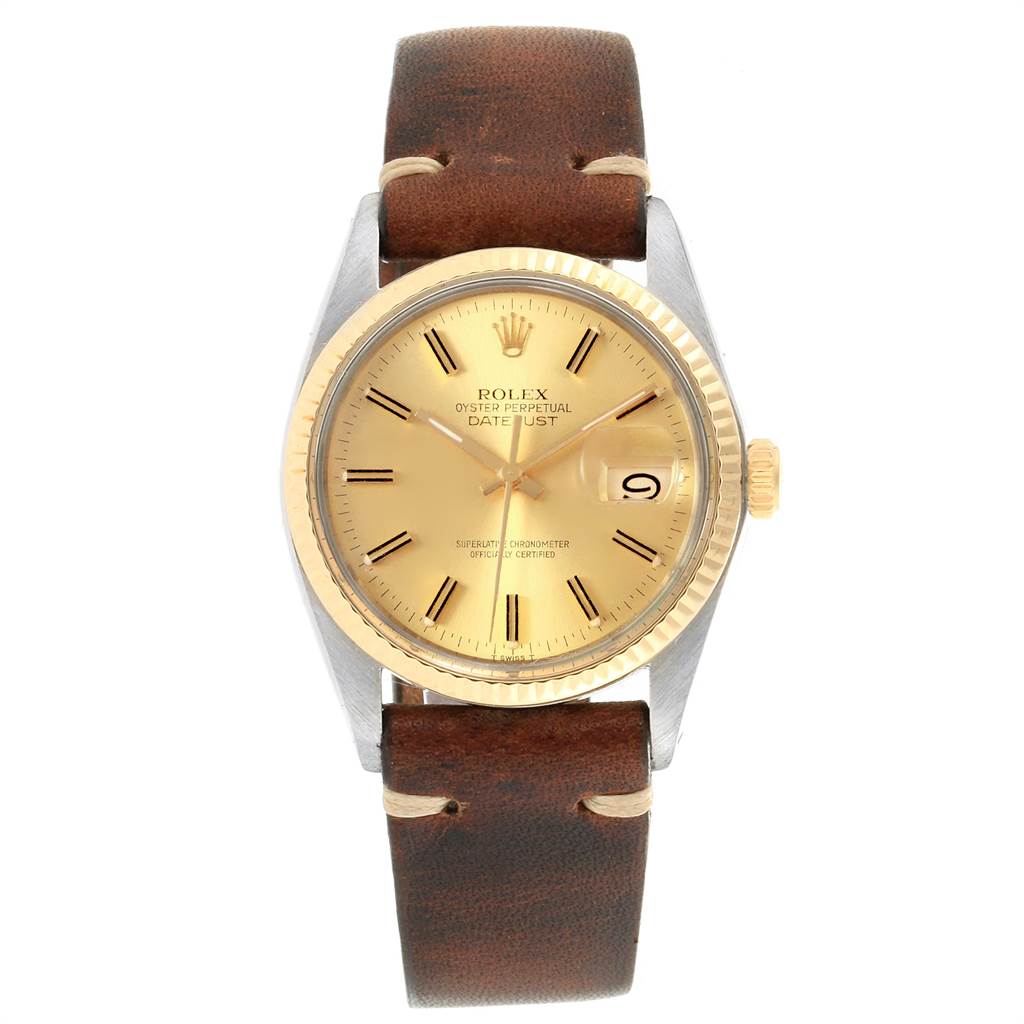 The image shows a Rolex Vintage Collection 16013 Men
s Stainless Steel Champagne Dial 16013 Men
s Stainless Steel Champagne Dial Datejust watch with a brown leather strap, gold dial, and fluted bezel from a front angle.