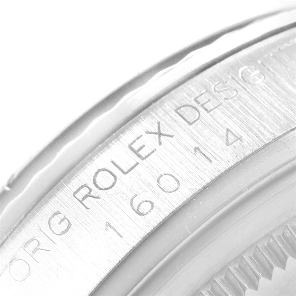 This close-up image shows the edge of the watch case and the serial number engraving on the Rolex Vintage Collection 16014 Men's Stainless Steel Silver Dial 16014 Men's Stainless Steel Silver Dial model.