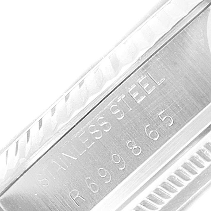 This close-up image shows the stainless steel back and model number of the Vintage Collection watch by Rolex.
