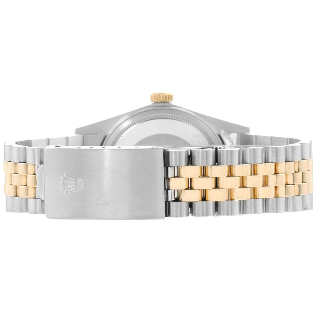 The image shows the back of the Rolex Vintage Collection 16013 Men's Steel and Gold (two tone) Champagne Dial 16013 Men's Steel and Gold (two tone) Champagne Dial watch, highlighting its two-tone bracelet and clasp.