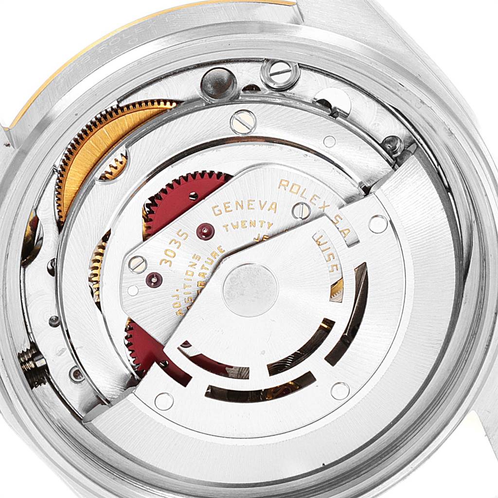 This image shows a close-up of the inner mechanical components of a Vintage Collection Rolex watch.