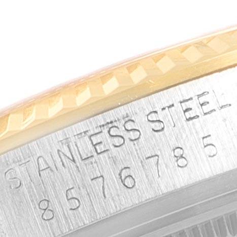 The image shows a close-up of the side of the Vintage Collection Rolex watch, highlighting its stainless steel case and serial number.