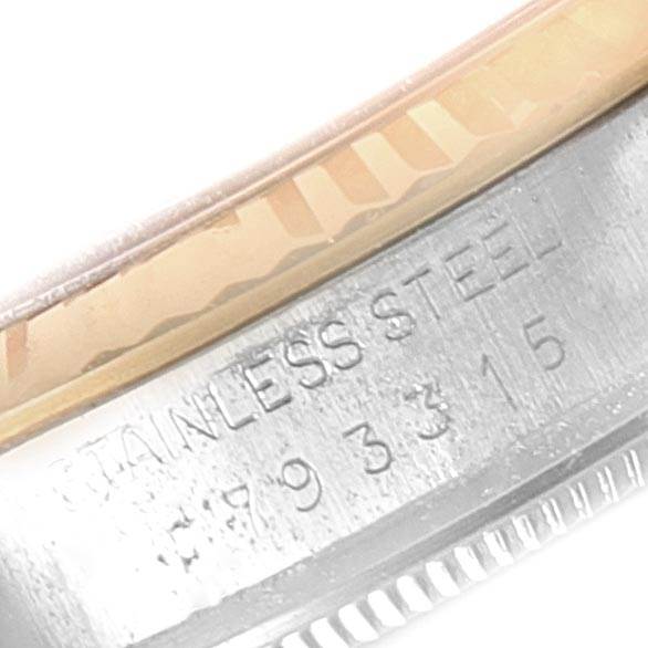 The image shows a close-up of the case side of a Vintage Collection Rolex watch, with the "STAINLESS STEEL" engraving and serial number visible.