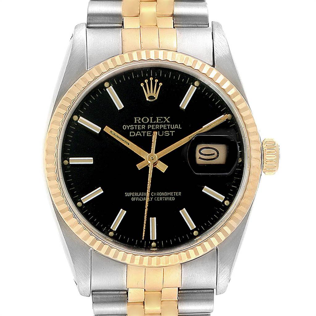 The image shows a front view of a Rolex Vintage Collection 16013 Men's Stainless Steel Black Dial 16013 Men's Stainless Steel Black Dial Datejust watch with a black dial and gold and silver bracelet.