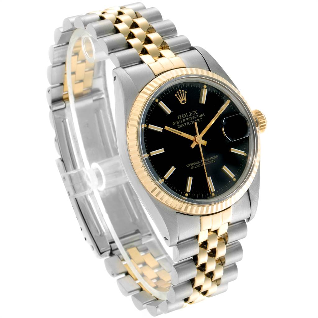 The image shows a Rolex Vintage Collection 16013 Men's Stainless Steel Black Dial 16013 Men's Stainless Steel Black Dial watch angled to display its black dial, gold bezel, and two-tone metal bracelet.