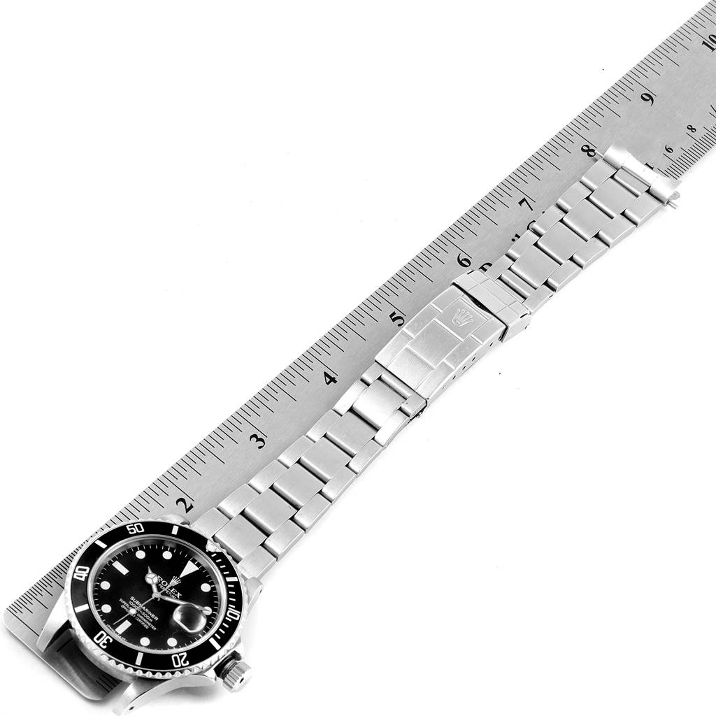The image shows the Rolex Vintage Collection 16800 Men's Stainless Steel Black Dial 16800 Men's Stainless Steel Black Dial watch laid flat alongside a ruler, displaying the face, bezel, and metal bracelet.