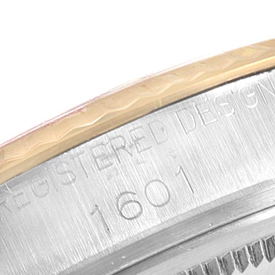 Close-up of the bezel and engraved case back of the Rolex Vintage Collection 1601 Men
s Steel and Gold (two tone) Champagne Dial 1601 Men
s Steel and Gold (two tone) Champagne Dial model 1601.