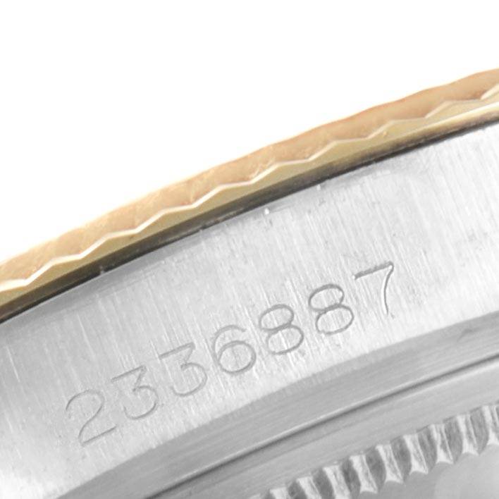 The image shows a close-up angle of the serial number etched on the case of a Vintage Collection Rolex watch.
