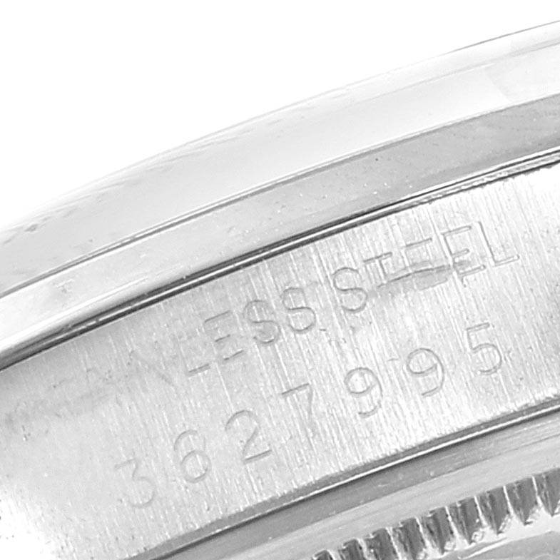 The image shows a close-up of the serial number and "STAINLESS STEEL" engraving on the side of the Vintage Collection model by Rolex.