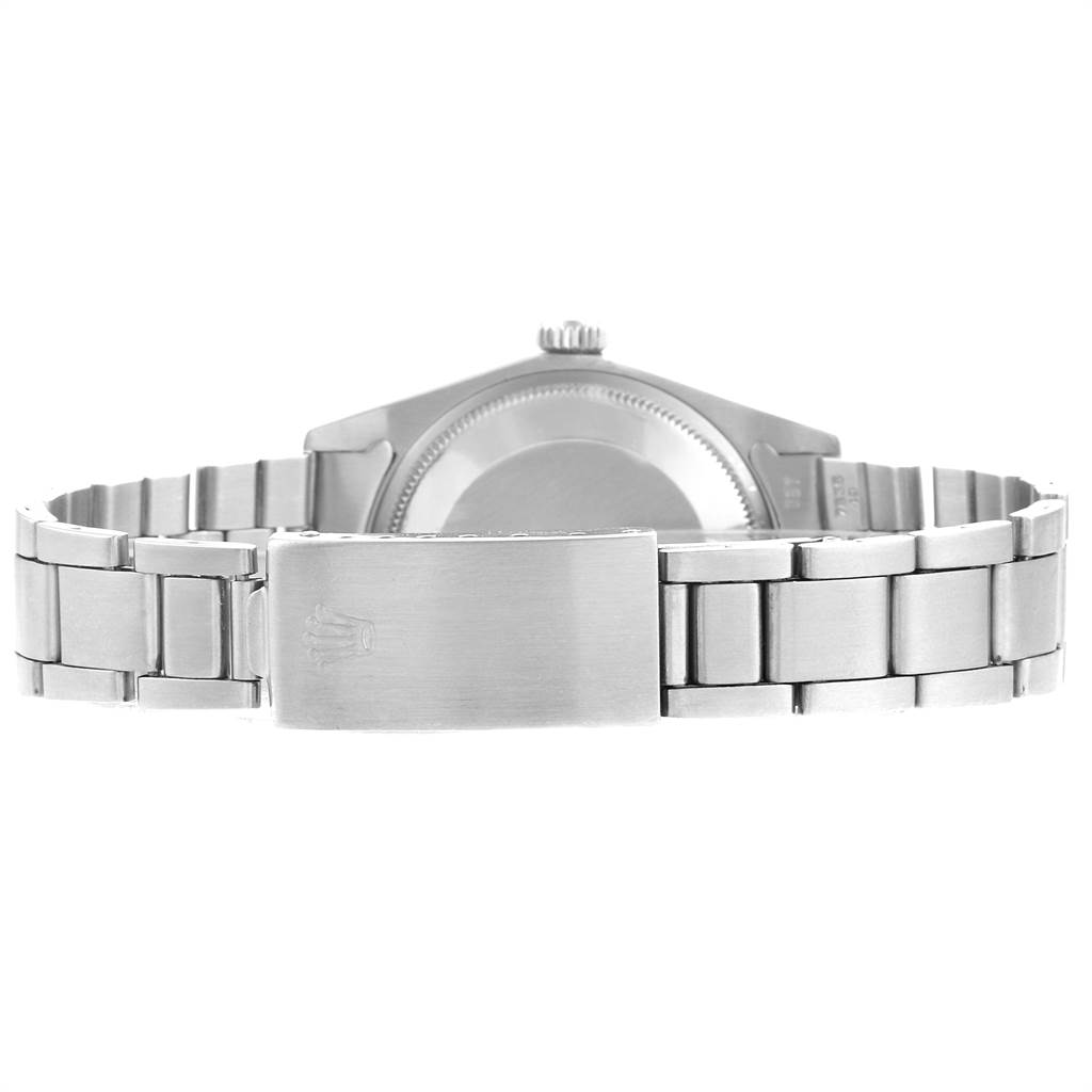 The image shows the back view of a Vintage Collection Rolex watch, focusing on the clasp and metal bracelet.