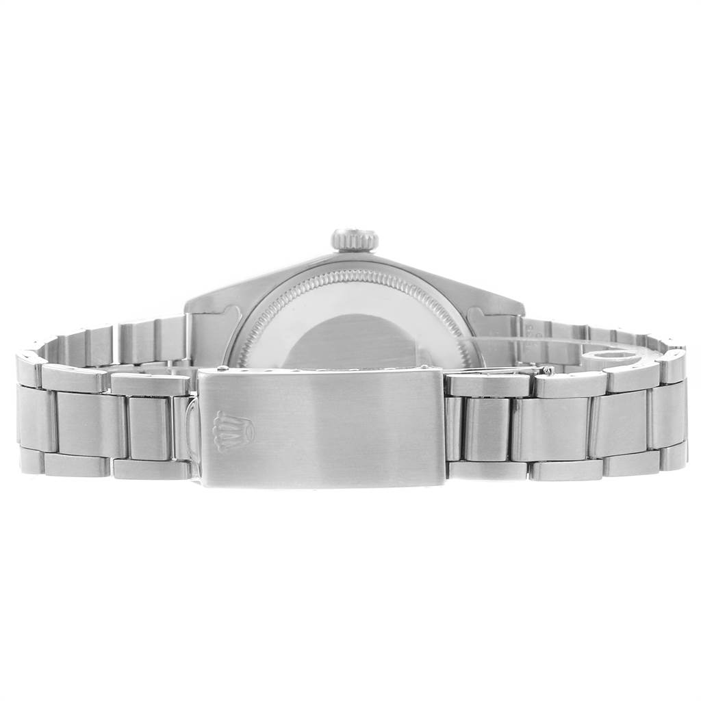The image shows the back view of the Rolex Vintage Collection 1500 Men's Stainless Steel Silver Dial 1500 Men's Stainless Steel Silver Dial watch and its stainless steel bracelet with clasp.