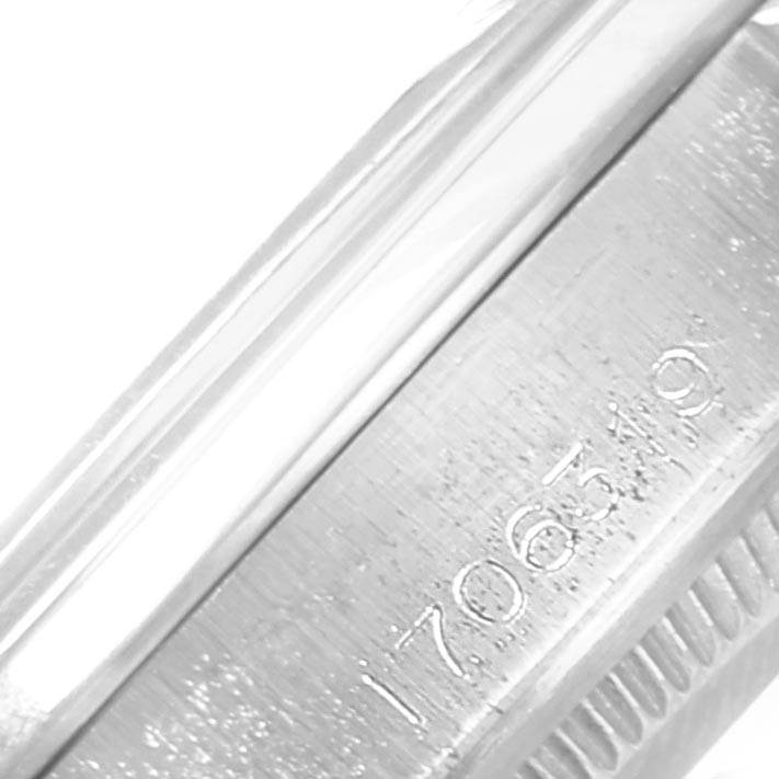 This is a close-up of the engraved side of the Rolex Vintage Collection 1500 Men's Stainless Steel Silver Dial 1500 Men's Stainless Steel Silver Dial watch case showing the serial number.