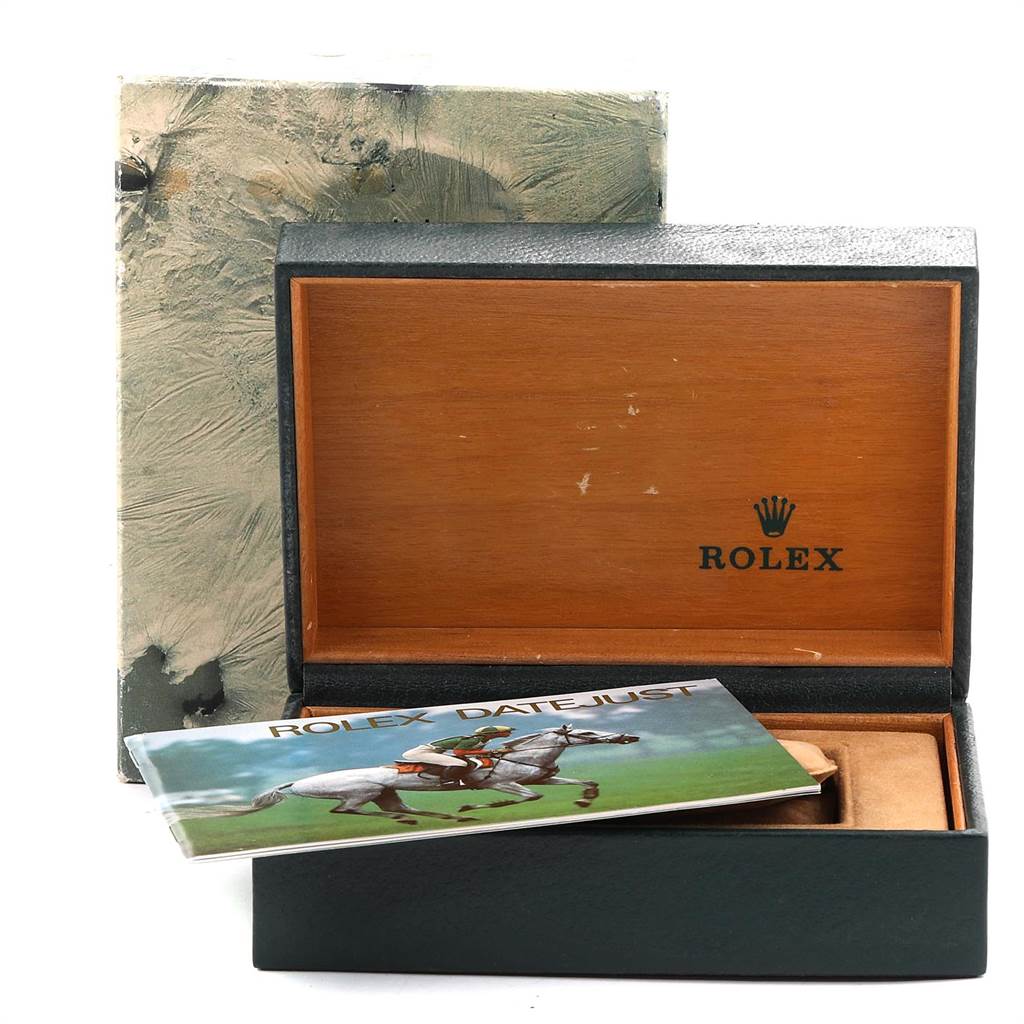 The image shows the open box and booklet of a Rolex Vintage Collection 16013 Men
s Stainless Steel Black Dial 16013 Men
s Stainless Steel Black Dial watch, revealing the interior but not the watch itself.