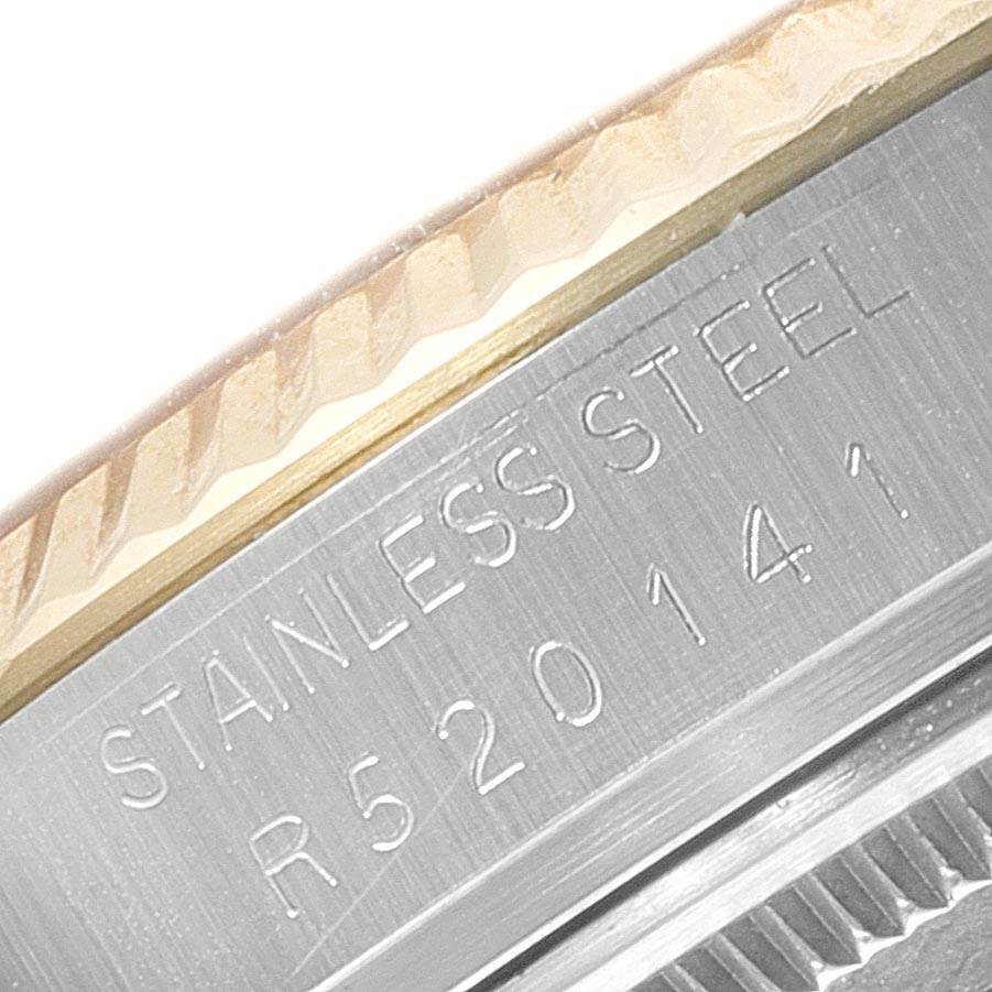 This image shows a close-up of the side of a Rolex Vintage Collection 16013 Men's Stainless Steel Champagne Dial 16013 Men's Stainless Steel Champagne Dial model watch, focusing on the serial number engraved in the stainless steel.