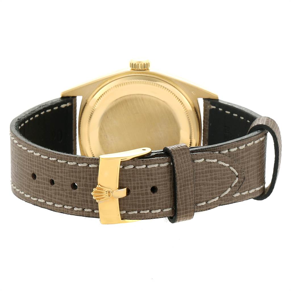 This image shows the back case, crown, and strap of the Vintage Collection model by Rolex.