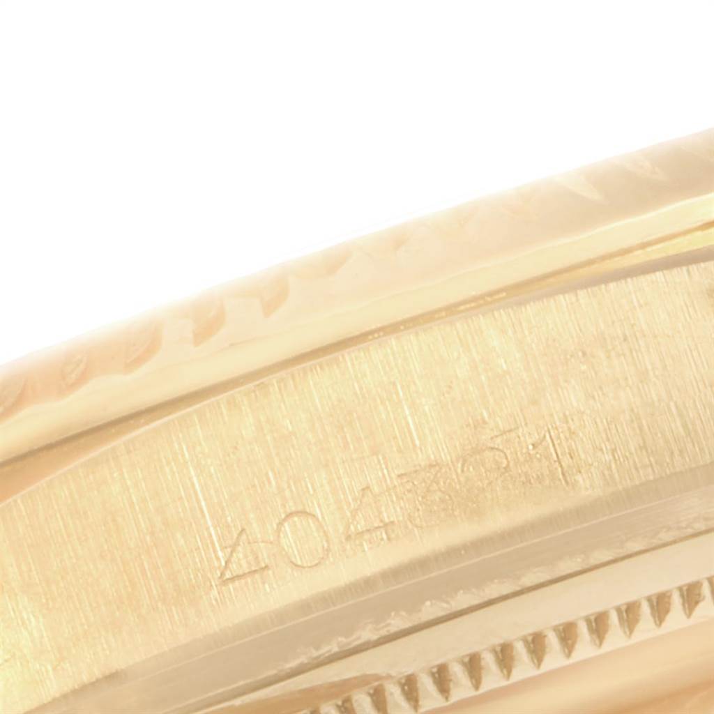 This close-up image shows the engraved side of the bezel of a Vintage Collection Rolex watch.