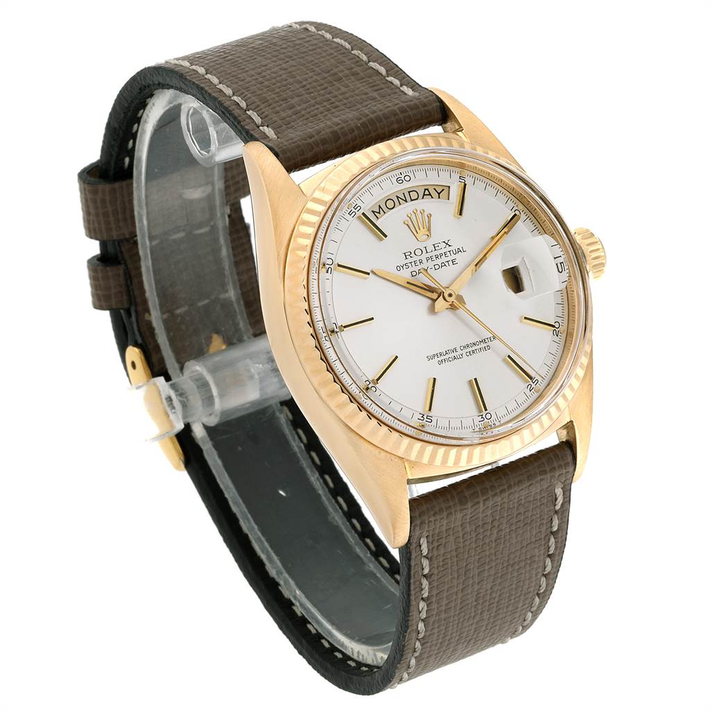 The image shows a Vintage Collection model by Rolex from a front angle, highlighting the dial, bezel, and leather strap.