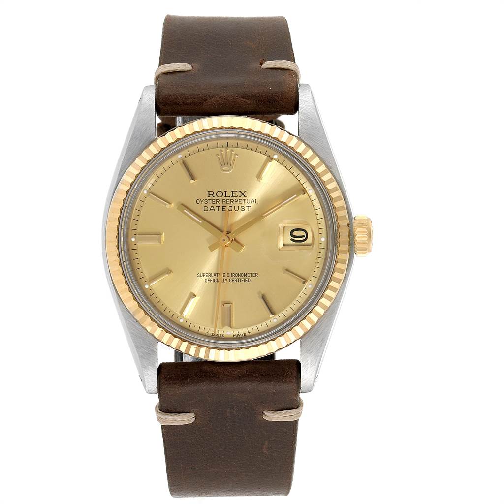 The image shows a front view of a Rolex Vintage Collection 1601 Men's Steel and Gold (two tone) Champagne Dial 1601 Men's Steel and Gold (two tone) Champagne Dial Oyster Perpetual Datejust watch with a brown leather strap and gold dial.