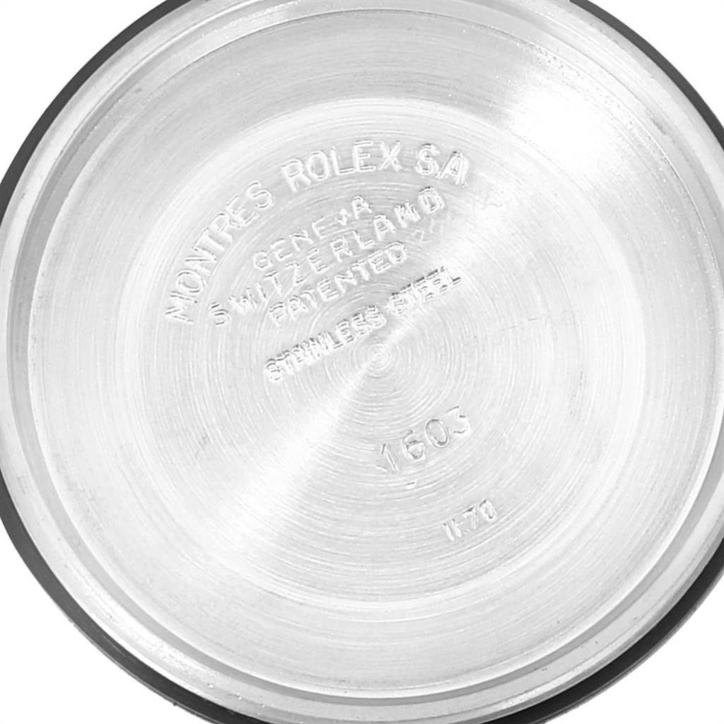 The image shows the case back of a Rolex Vintage Collection 1603 Men's Stainless Steel Brown Dial 1603 Men's Stainless Steel Brown Dial model, displaying its inscriptions and stainless steel material.