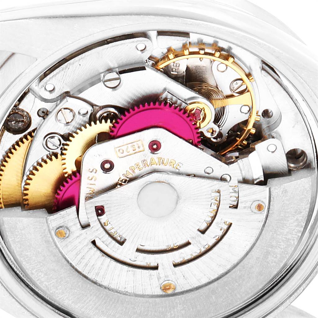 This image shows the exposed intricate internal mechanism of the Vintage Collection model by Rolex from a close-up angle.